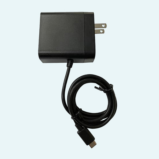 Lofta Explore CPAP Battery Smart Wall Charger on light blue background.