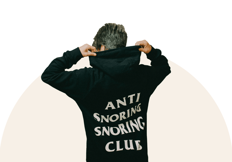 Man lifting the hoodie of his Anti Snoring Sleep Club Jacket