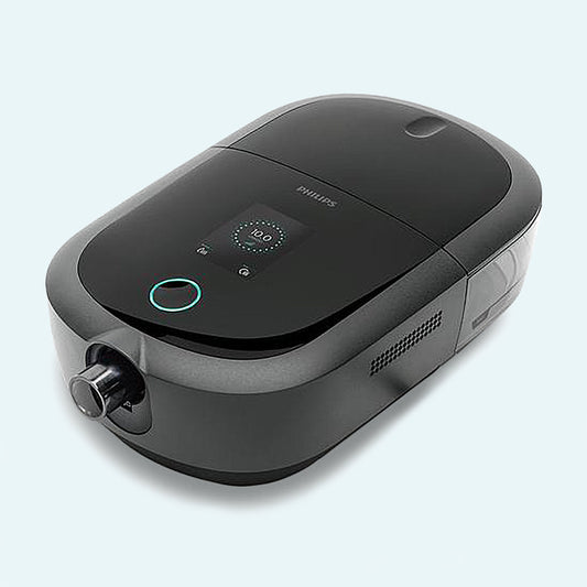 DreamStation 2 Auto CPAP Advanced with Humidifier on light blue background.