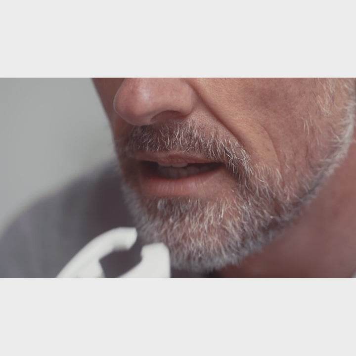 A video of a man inserting the eXciteOSA into his mouth for alternative CPAP therapy for sleep apnea