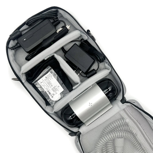 Open React Health Luna TravelPAP carrying case with a compact PAP device, power supplies, tubing, mask, and accessories organized in padded compartments