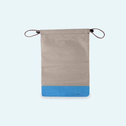 ResMed AirMini™ Travel CPAP Drawstring Storage Bag on light blue background.