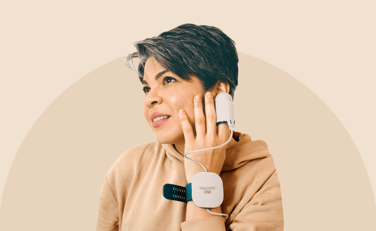 Woman wearing a WatchPat One device for a home sleep test
