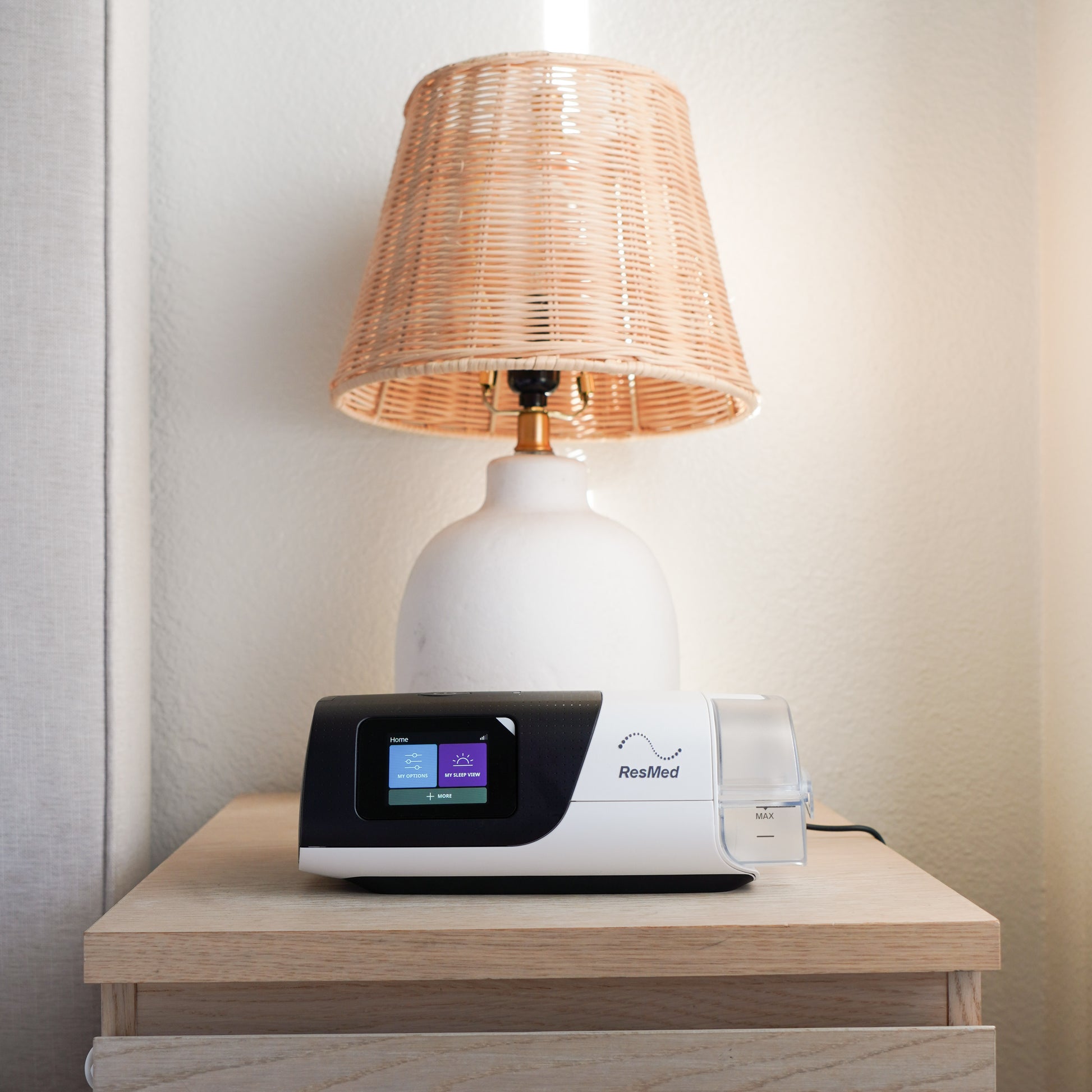 The portable AirSense 11 placed on on bedside table